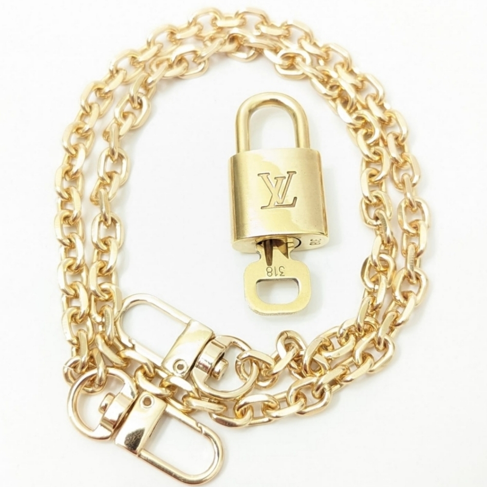 Louis Vuitton Gold Padlock and key ONLY..
